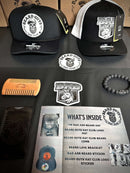 Deluxe Hat Subscription box by beard guys hat club with inside product image including hats, stickers, beard comb, hand bracelet and many mores