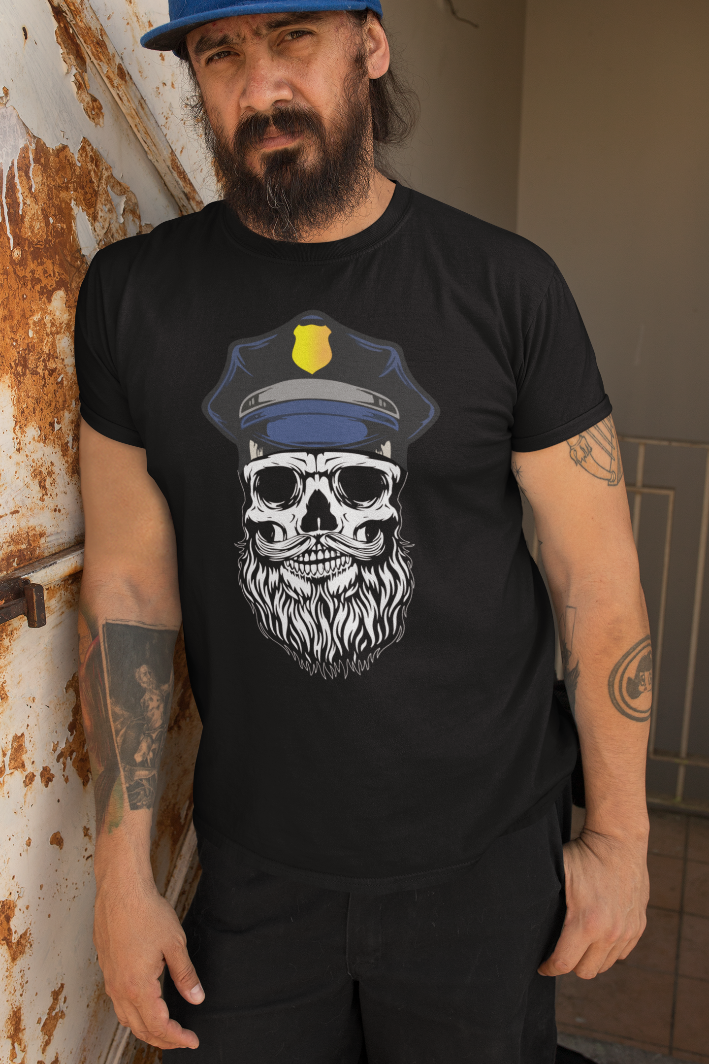 Bearded Cop Skull Police on a black t-shirt worn by a man against a rustic background.