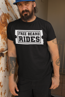 Man wearing a black tee shirt with 'Free Beard Rides' graphic printed on front, showcasing a fun and humorous style.