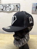 Super Beard Man Black Out Trucker Hat displayed on a bust model, featuring a stylish black design and mesh back.