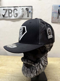 Super Beard Man Black Out Trucker Hat displayed on a bust model, featuring a stylish black design and mesh back.
