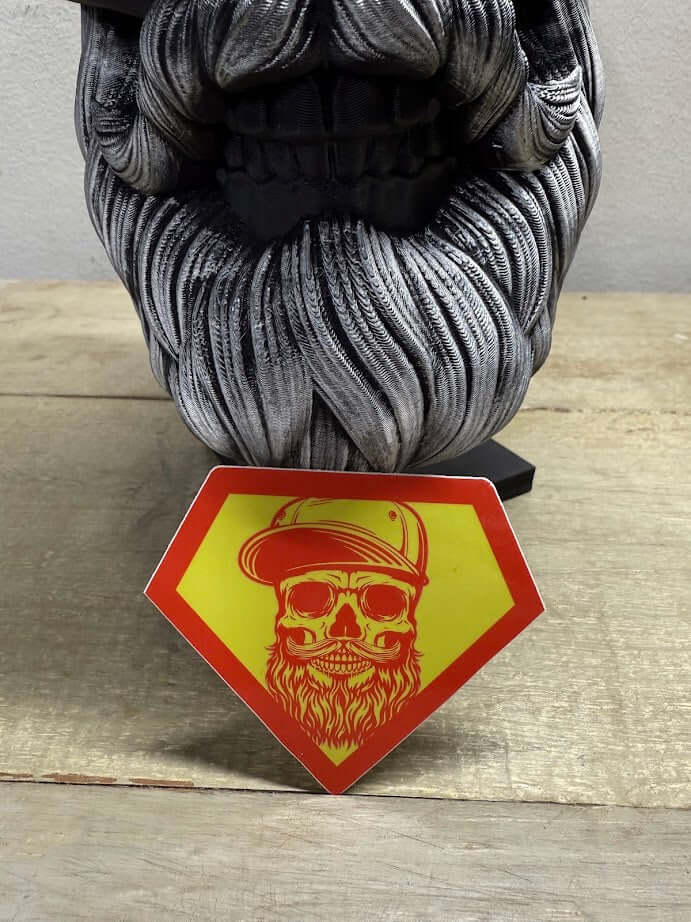 Super Beard Man sticker on wooden surface, featuring a bold bearded character in superhero style.