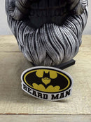 Beard Man sticker featuring a stylish bearded man in Batman logo design, placed on a textured surface.
