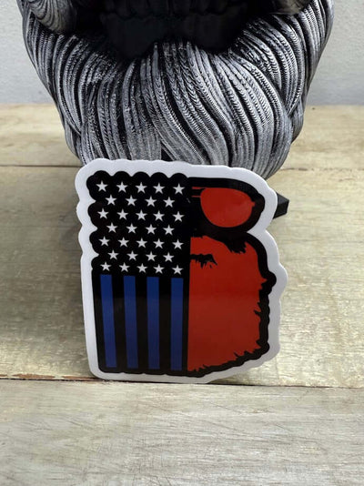Beard American Flag Guy 3-Inch Sticker on wood surface, featuring a bearded figure and red, white, and blue design.