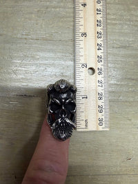 Bearded Skull Guy Men stainless steel heavy duty ring on finger next to ruler for size reference.