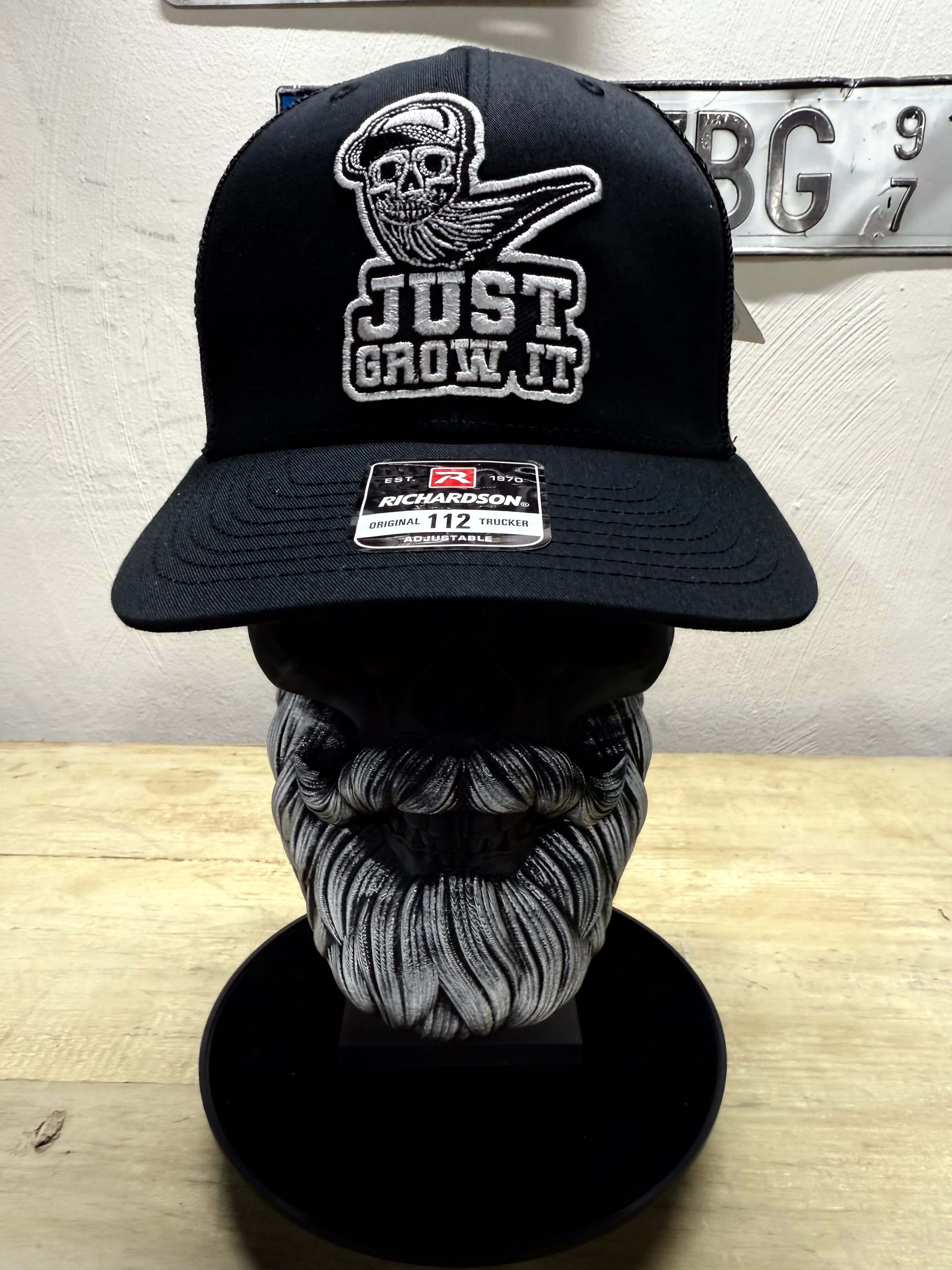 I Just Grow It Bearded Skull Trucker Hat Front