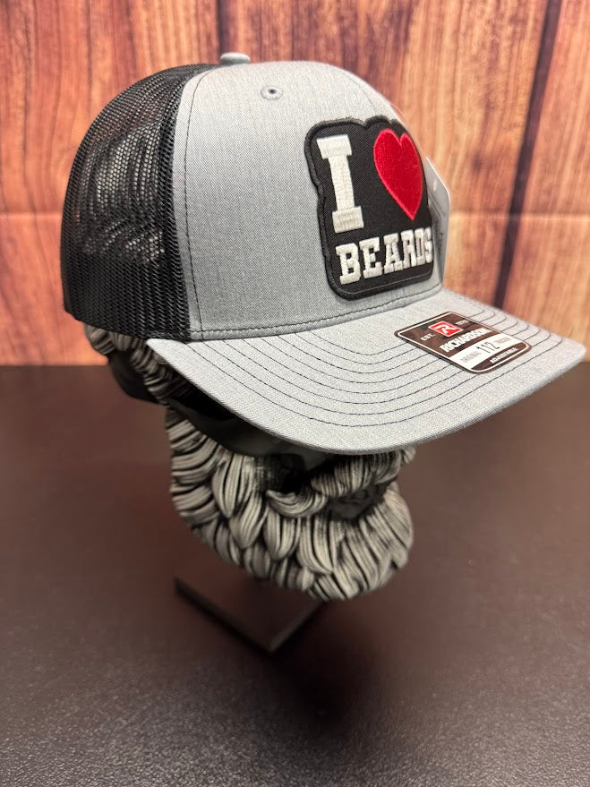 Gray and black cap with 'I ❤️ BEARDS' patch on a wooden background