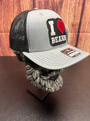 Gray and black cap with 'I ❤️ BEARDS' patch on a wooden background
