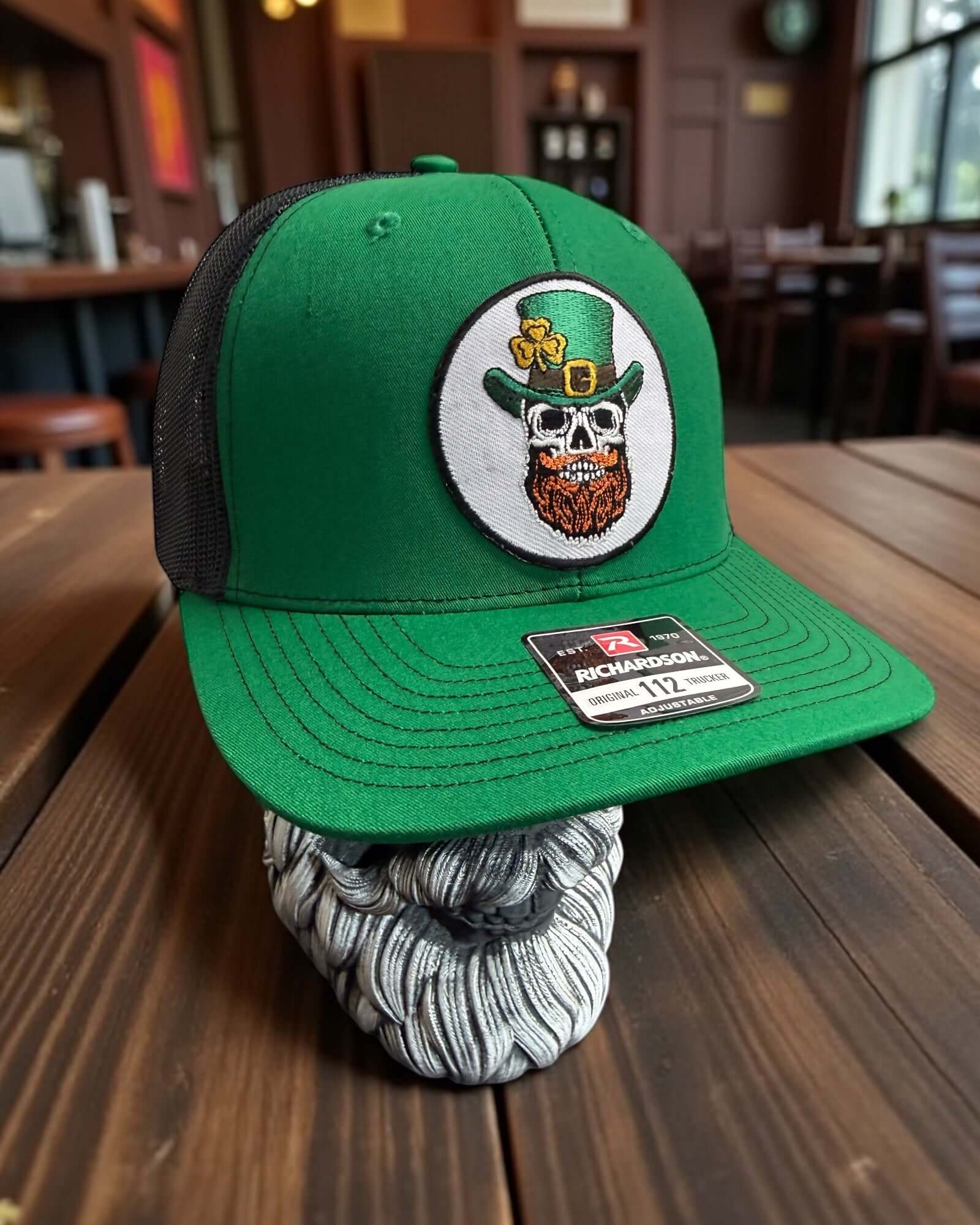 St Patrick’s Day Lucky Beard Skull Trucker Hat front view,  St Patrick’s Day Lucky Beard Skull Trucker Hat side mesh panel,  St Patrick’s Day Lucky Beard Skull Trucker Hat adjustable snapback back view,  Lucky Beard Skull graphic detail on St Patrick’s Day trucker hat