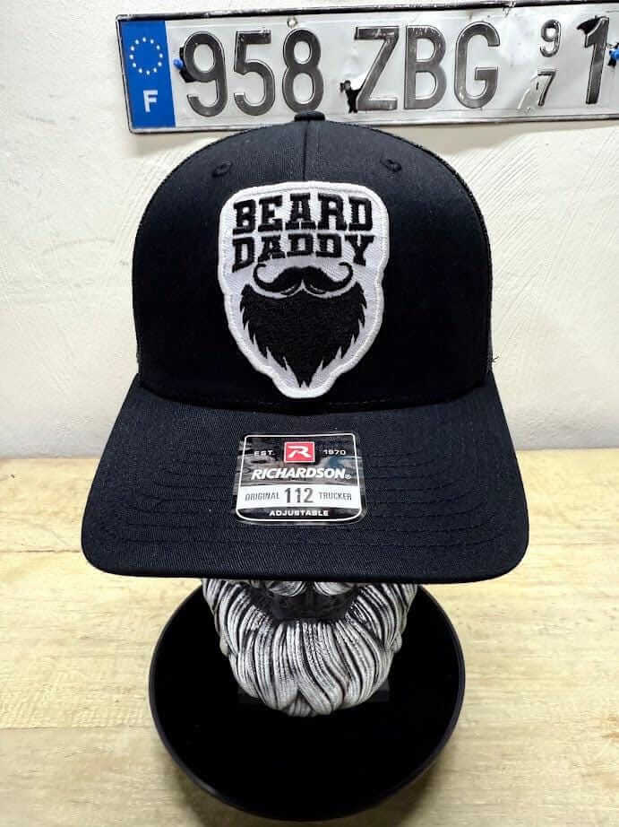 Black Beard Daddy trucker hat with embroidered beard patch, perfect headgear for bearded fathers.