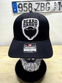 Black Beard Daddy trucker hat with embroidered beard patch, perfect headgear for bearded fathers.