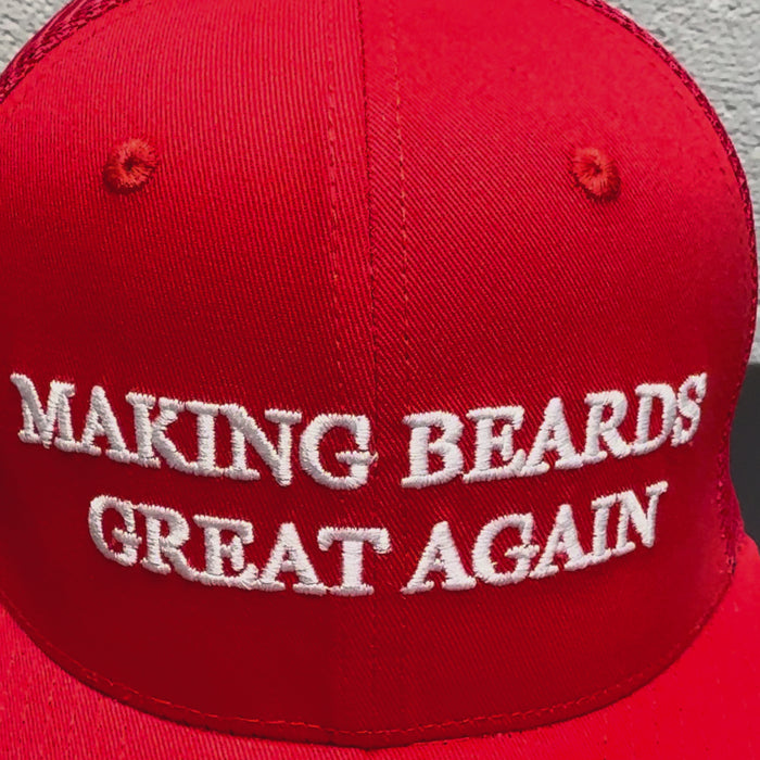 Red baseball cap with the slogan “Making Beards Great Again
