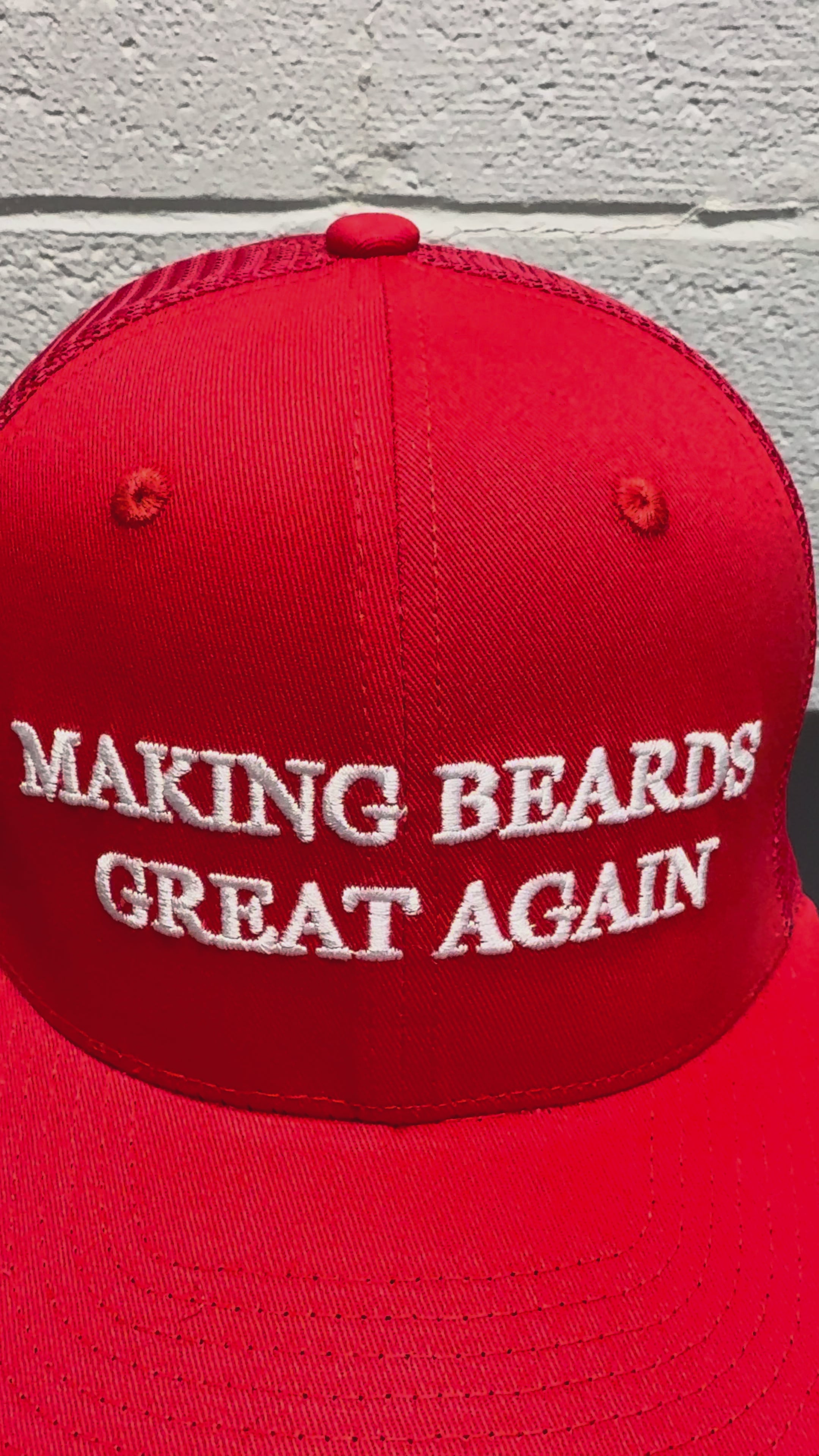 Red baseball cap with the slogan “Making Beards Great Again